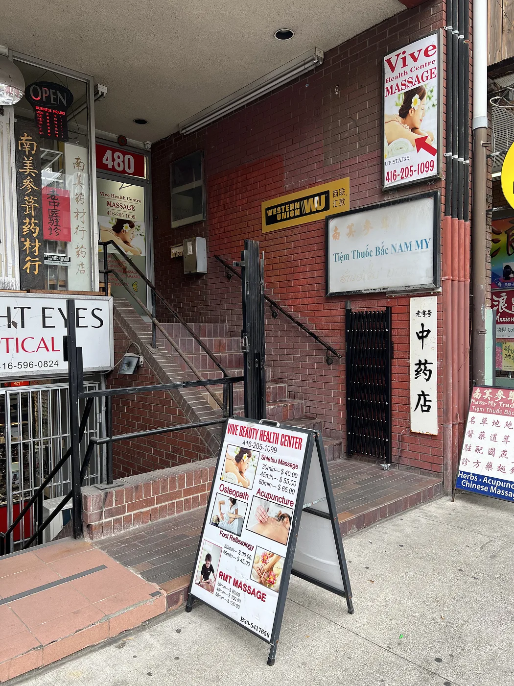 Entrance to Vive Beauty Health Centre at 480 Dundas Street West with stairs leading to unit #2